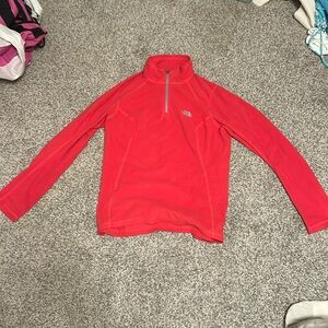 Red North Face fleece zip-up